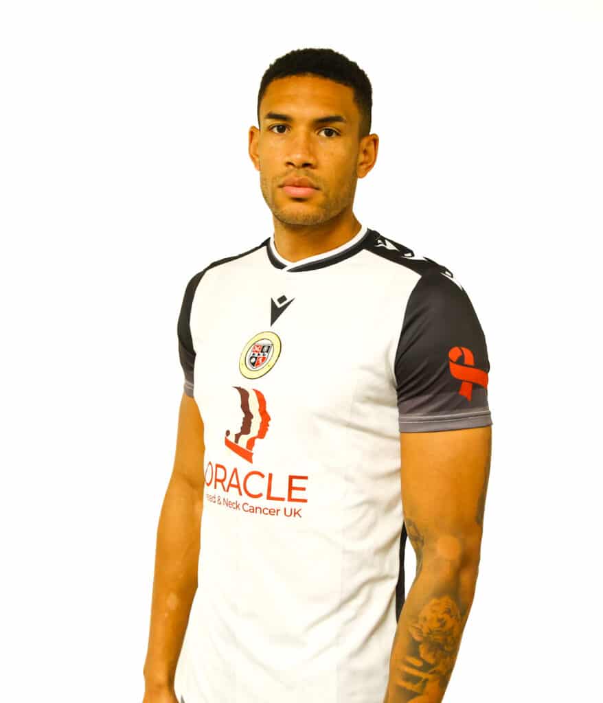 Bromley FC player wearing a Bromley football shirt with the Oracle logo at the front