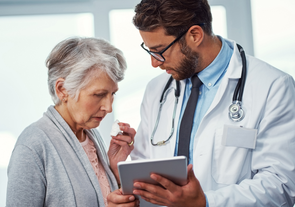 Doctor showing patient a chart and the patient looking concerned